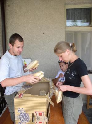 49: Michal and Tereza preparing bread packages.