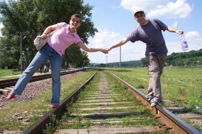 19: Happy people running along the railway track.