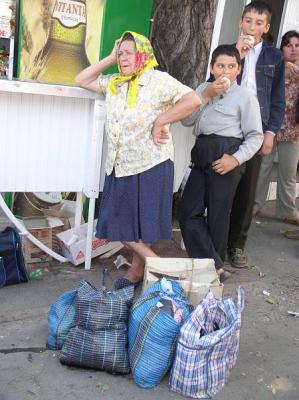 57: A typical babushka waiting at the bus station.