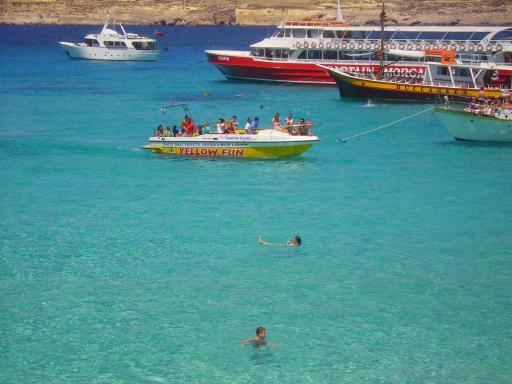 3: Amazing yellow fun boat to Comino