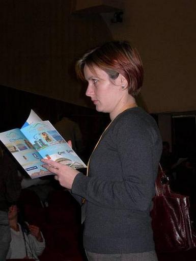 28: Orsi Balogh, CD member for PR, studying carefully the booklet. But wait! Something caught her attention!