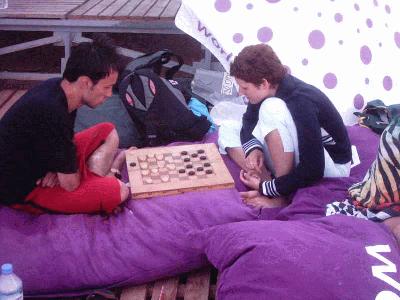 1: playin(teaching) backgammon.
believe me it is not for girls:)