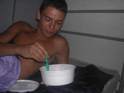 153: Tony, the mediterranean boy, eating his pasticcio in the middle of the night.