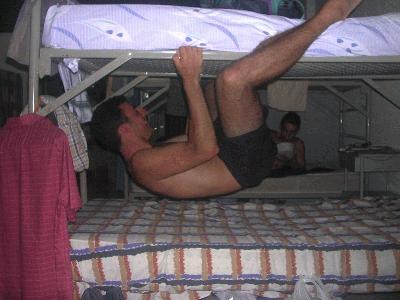 156: Agusti making kamacci to the bed above him. Also know as position nr. 115 from the Kamasutra: Koala-style.