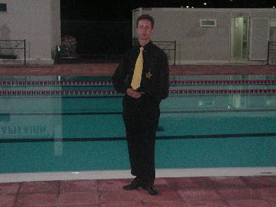 117: Me in front of the pool at the place where we got lunch from the mayor of Larissa. My blouse and tie are the official clothing of my Yearclub Korsakov.