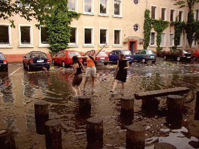 9: Sudden thunderstorms flooded the school yard and the girls were in their element!